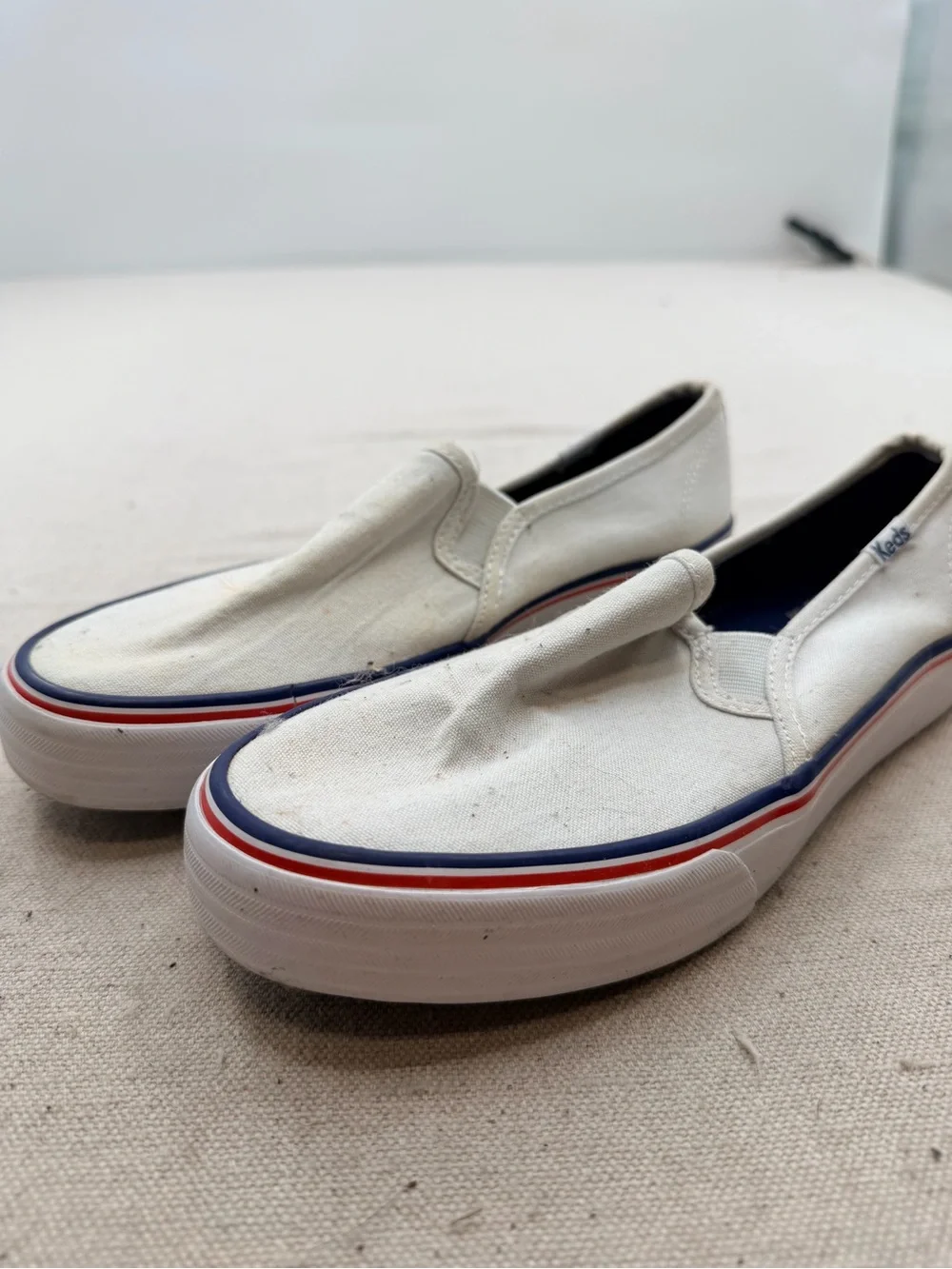 Keds White Canvas Slip-On Loafers with Red & Blue Trim